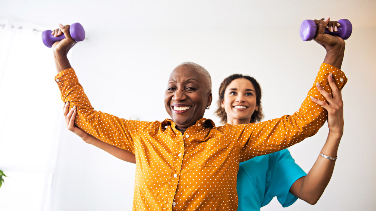 Younger family member helping with grandma's physical therapy