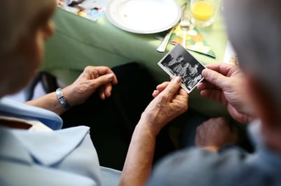 Couple holding photo