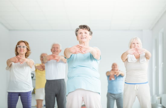 older adults taking a fitness class together