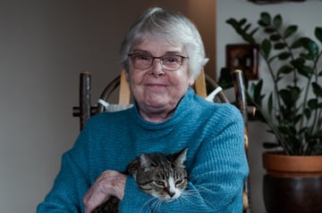 woman holding cat