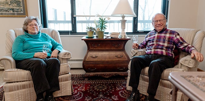 husband and wife enjoying wine