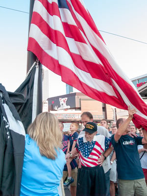 Holding the flag up