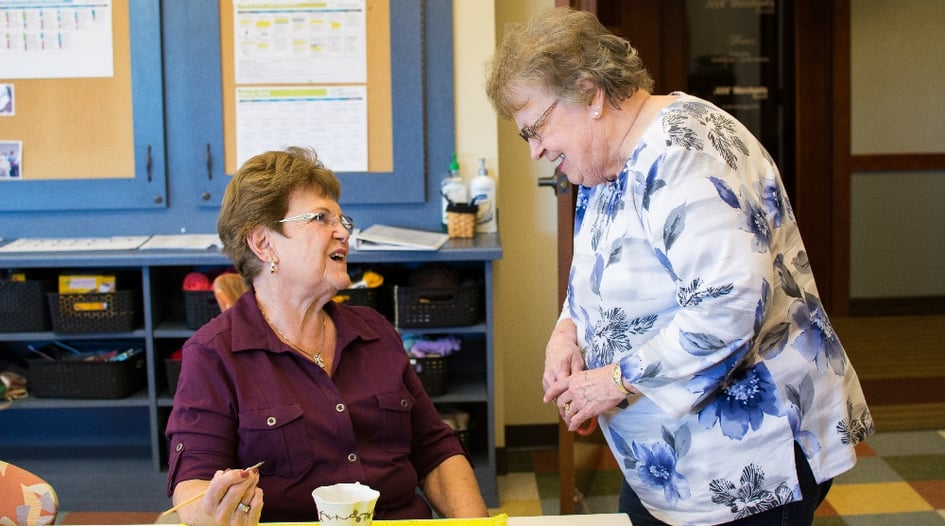 women talking in art room